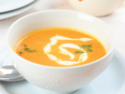 Carrot cream soup with cream.  Soup puree from carrots and potatoes.  Soup - carrot puree with coconut milk.