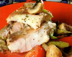 Cod with carrots and onions in a pan.  Braised cod with vegetables.  Cod stewed with vegetables.  Classic recipe.